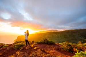 mountain sunrise with lone hiker